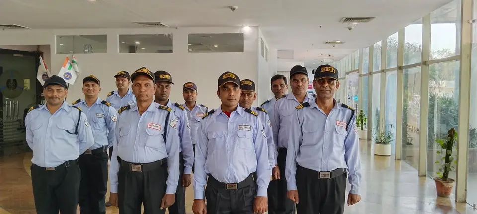 Surinder Mohindra Security Agency (SMSA) guards in uniform assembled in a client building lobby